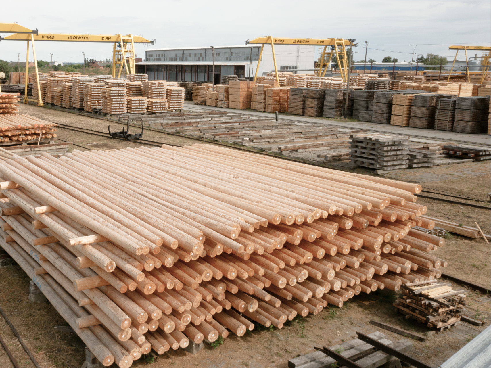 a large pile of wood sitting on top of a wooden floor